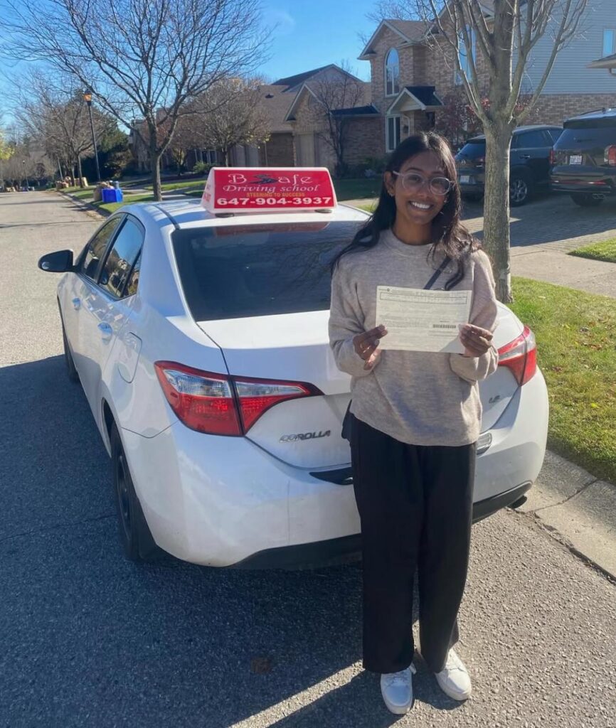 A happy bsafe driving school student - pass a driver's license test with one of the best female instructor